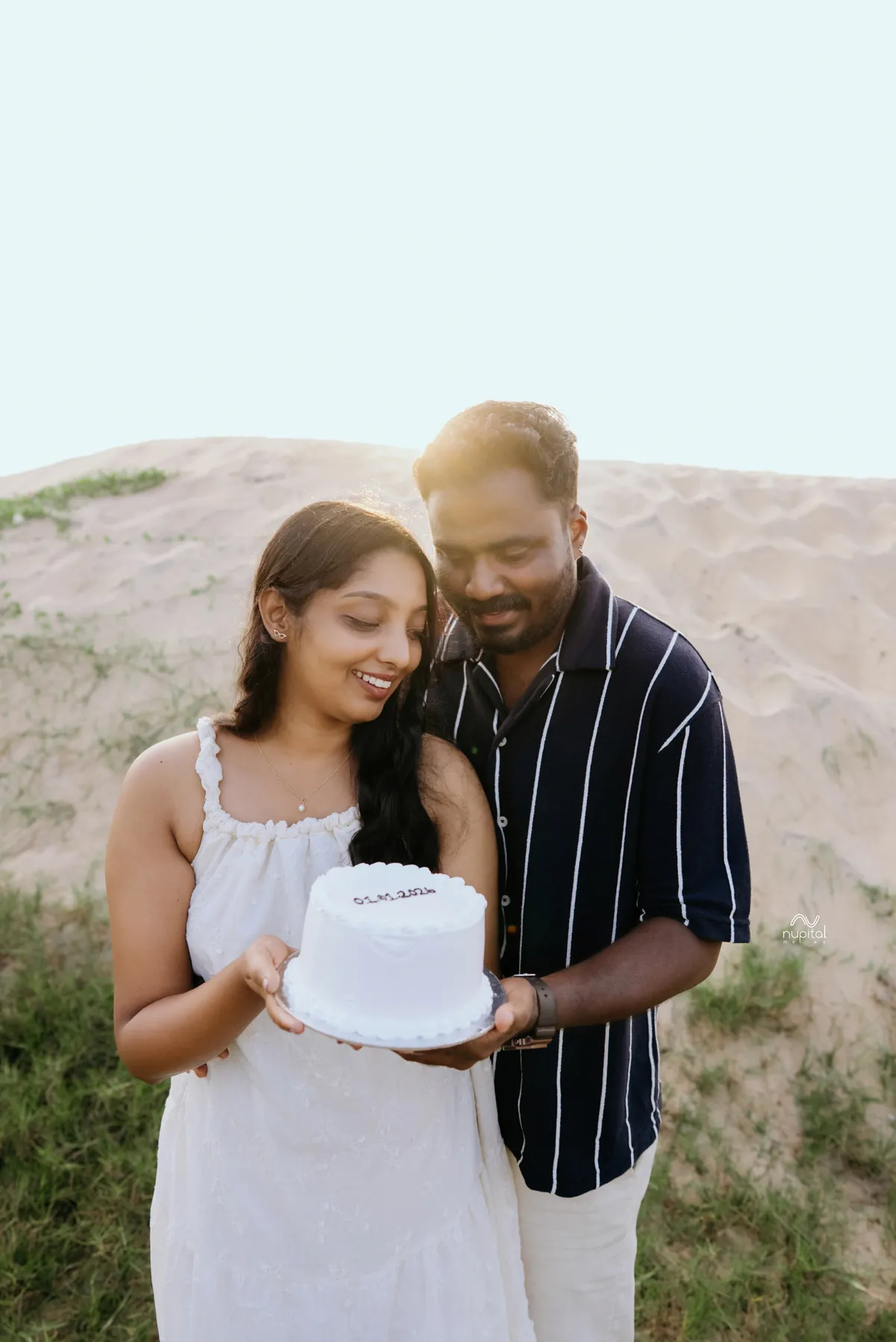 Celebrating their engagement with cake