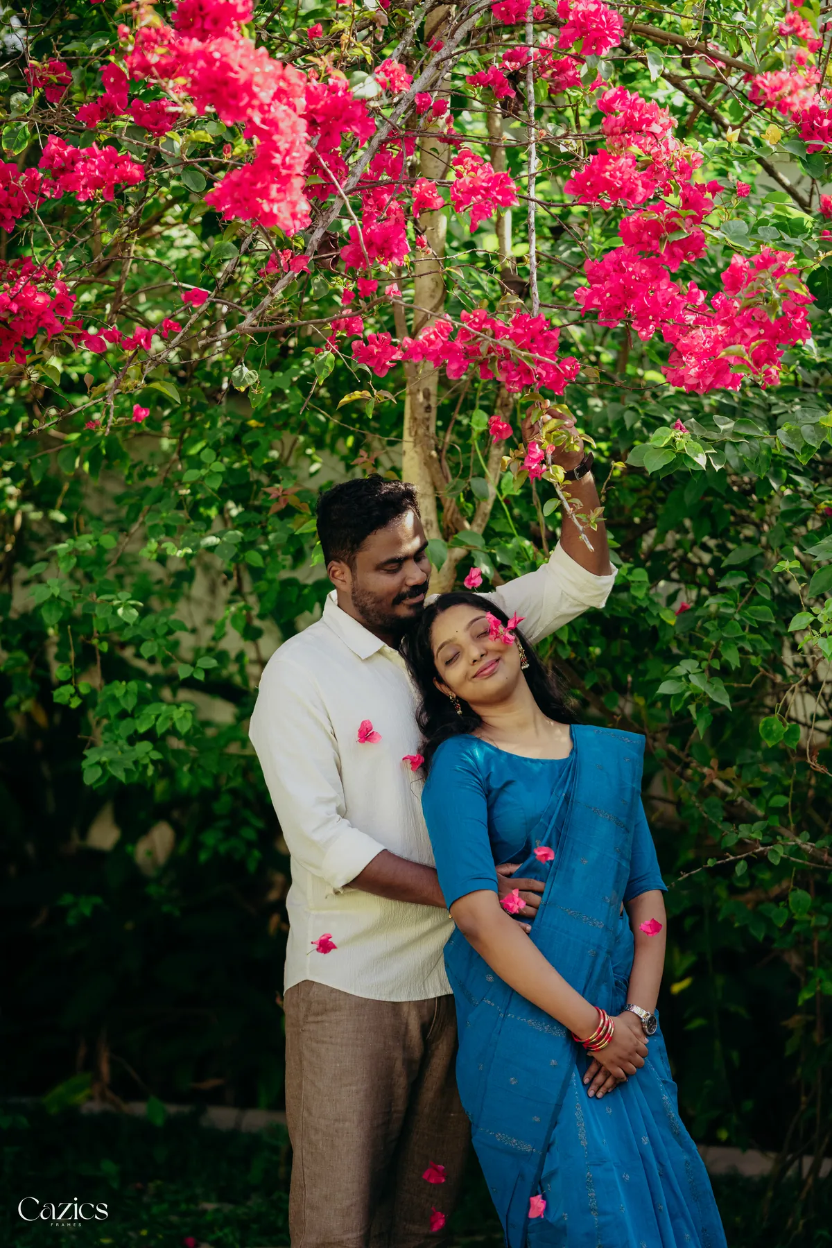 Deepak and Karuna under blooming bougainvillea